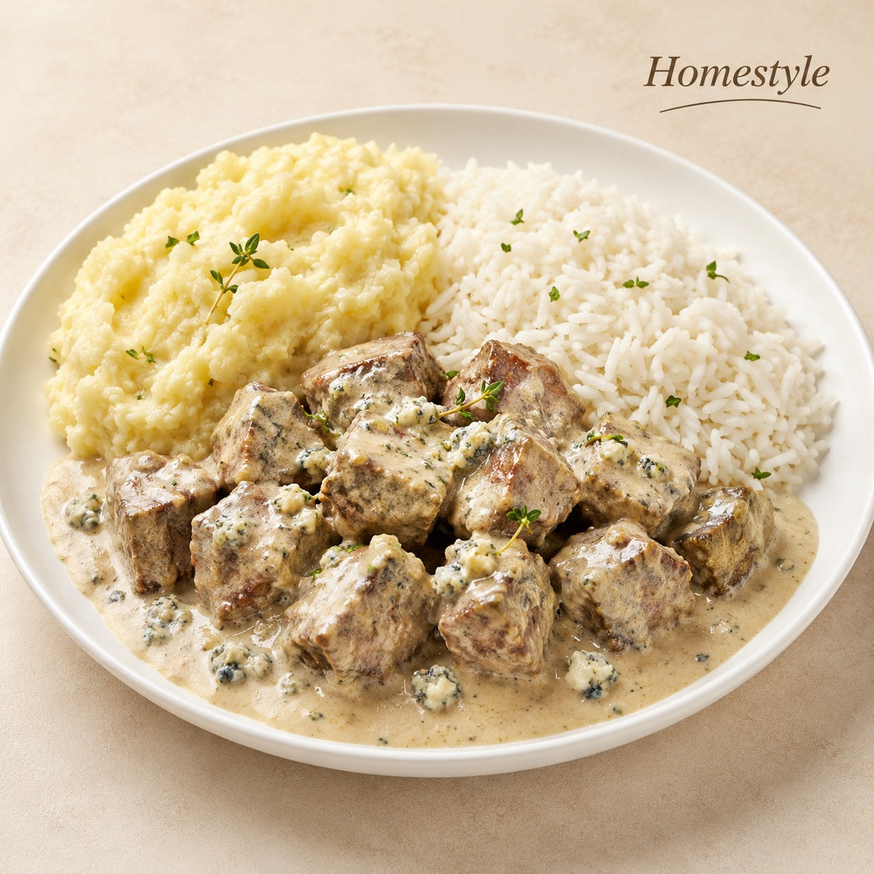 HOMESTYLE 300G- Filet mignon in gorgonzola sauce, rice and rustic mashed potatoes.