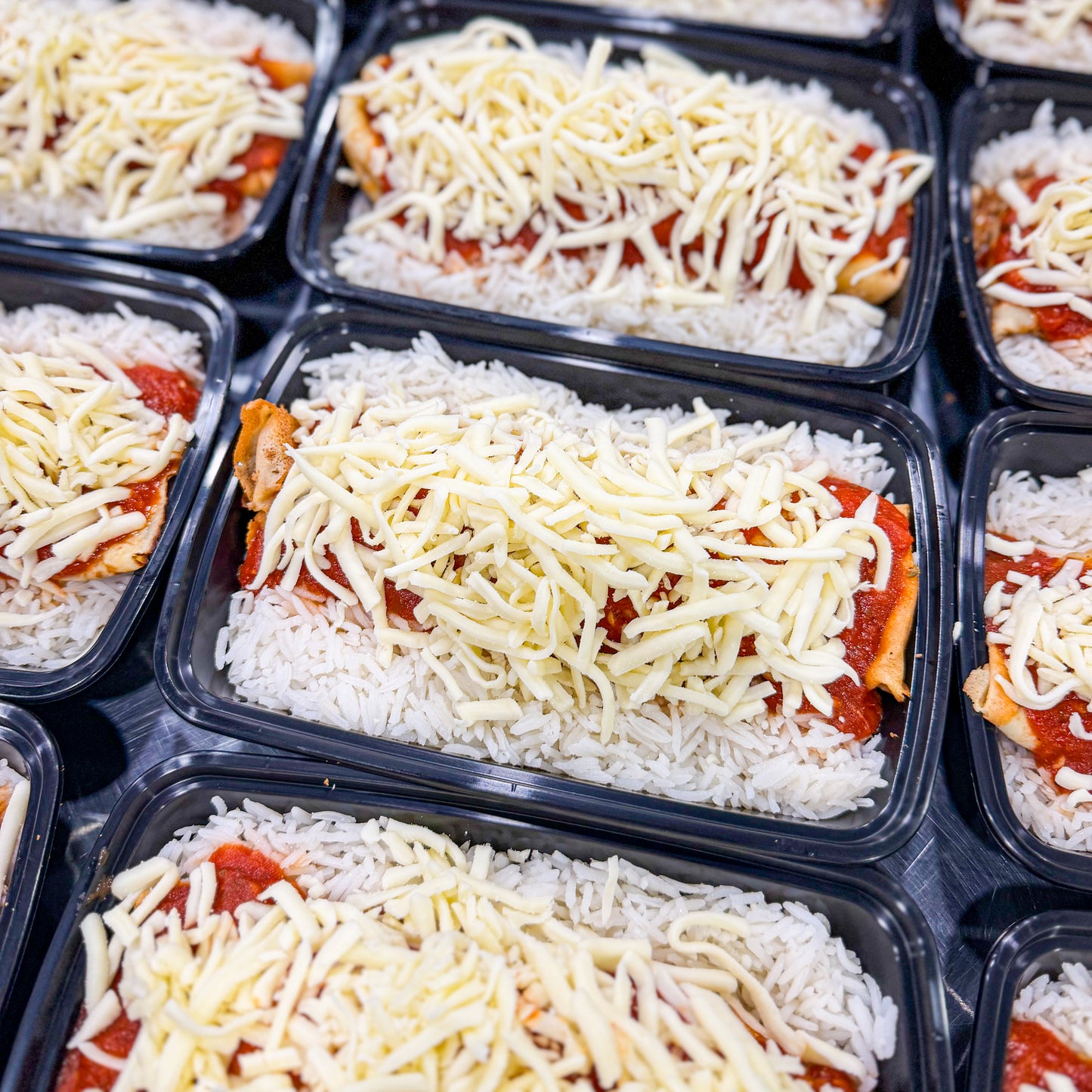 AVAILABLE NOW, FRESH- Ground beef pancakes with homemade tomato sauce, mozzarella cheese, and white rice.