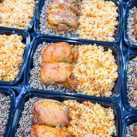 AVAILABLE NOW, FROZEN- Roasted boneless skinless chicken thighs, tri-color quinoa, and a warm chickpea salad with cauliflower rice and carrots.