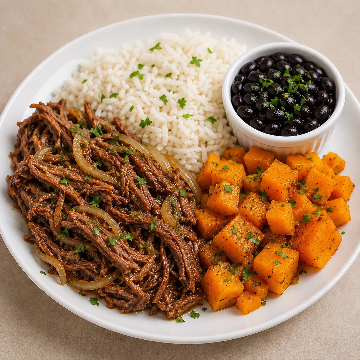 HOMESTYLE 300G- Shredded beef with sautéed onions, sautéed squash, rice and beans on the side.
