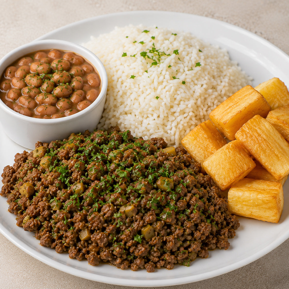 HOMESTYLE 300G- Ground beef with chopped olives, white rice, fried yuca, and beans on the side.