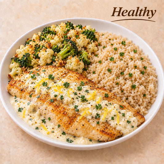 AVAILABLE NOW, FROZEN- Grilled tilapia with ricotta and Sicilian lemon sauce, brown rice and broccoli and cauliflower crumble.
